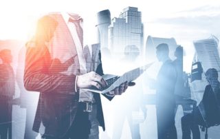 Man with laptop and his team in city | Pisut & Partners